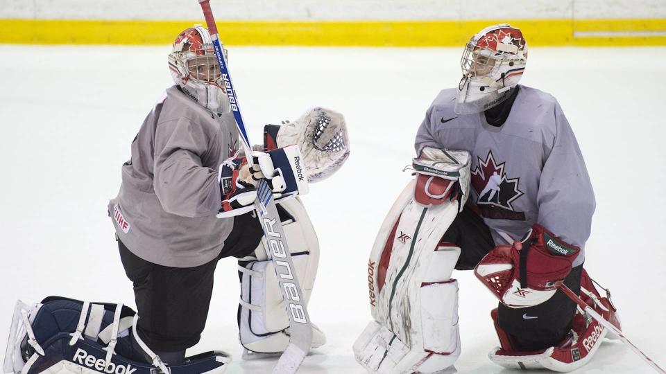 The coach of the Canadian world junior hockey team says Zach Fucale and Eric Comrie are still being evaluated as the starting goaltender job remains unfilled. The netminders have both already made the team.