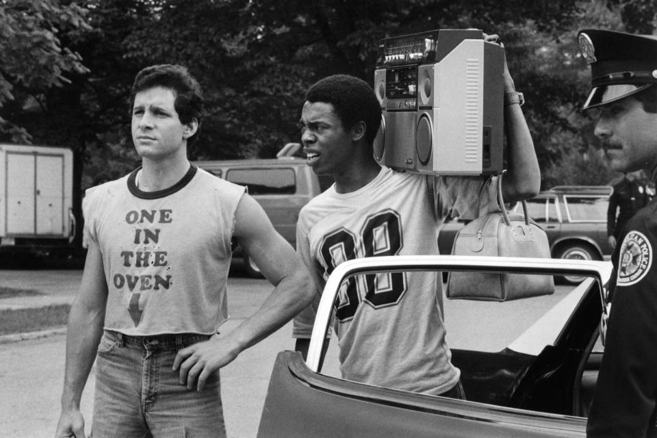 Steve Guttenberg and Michael Winslow arrive at the academy in a scene from the film 'Police Academy', 1984.