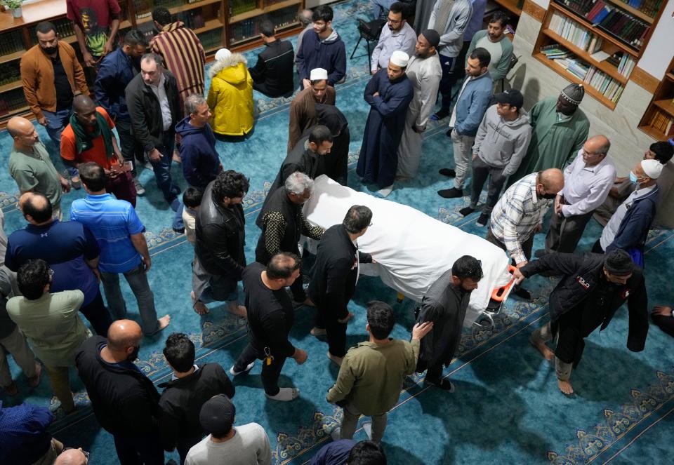The body of Sabrina Rahman is carried out of Masjid Khadijah at her funeral on Dec. 8. Rahman, 24, was one of the six people killed in the Dec. 5 shooting rampage.