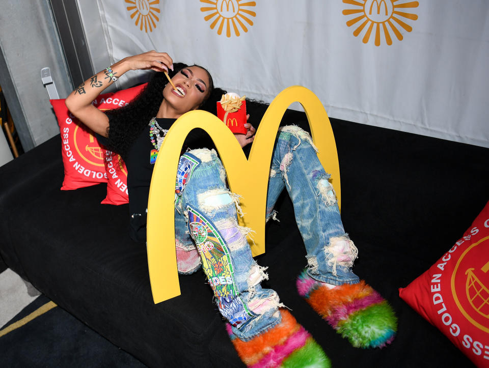 <p>Coi Leray sits back inside the McDonald's Golden Access Exclusive Music Experience at the Life Is Beautiful festival on Sept. 17 in Las Vegas. </p>