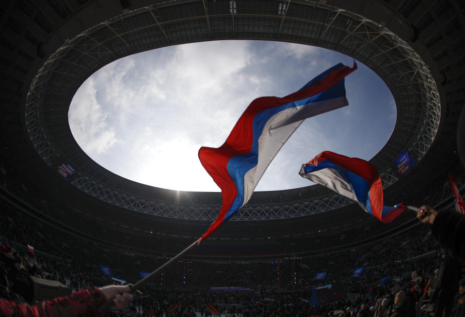 <p>People wave national flags as they take part in a rally to support Russian President Vladimir Putin in the upcoming presidential election at Luzhniki Stadium in Moscow, Russia, March 3, 2018. (Photo: Maxim Shemetov/Reuters) </p>