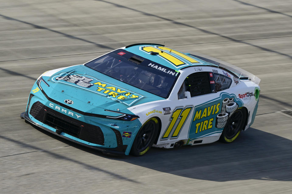 Denny Hamlin drives through Turn 2 during a NASCAR Cup Series auto race at Dover Motor Speedway, Sunday, April 28, 2024, in Dover, Del. Hamlin won the race. (AP Photo/Derik Hamilton)