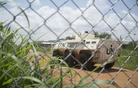 A United Nations peacekeepers ride in their armored personnel carrier (APC) as they patrol the perimeter of the protection of civilians site hosting about 30,000 people displaced during the recent fighting in Juba, South Sudan, July 22, 2016. REUTERS/Adriane Ohanesian