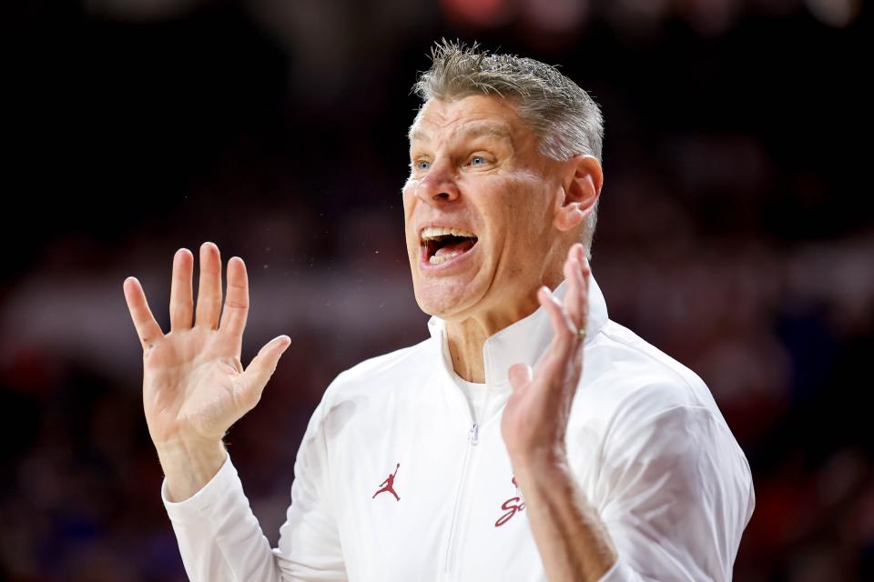 OU coach Porter Moser yells to his players during a game against Kansas on Feb. 17 at Lloyd Noble Center in Norman.