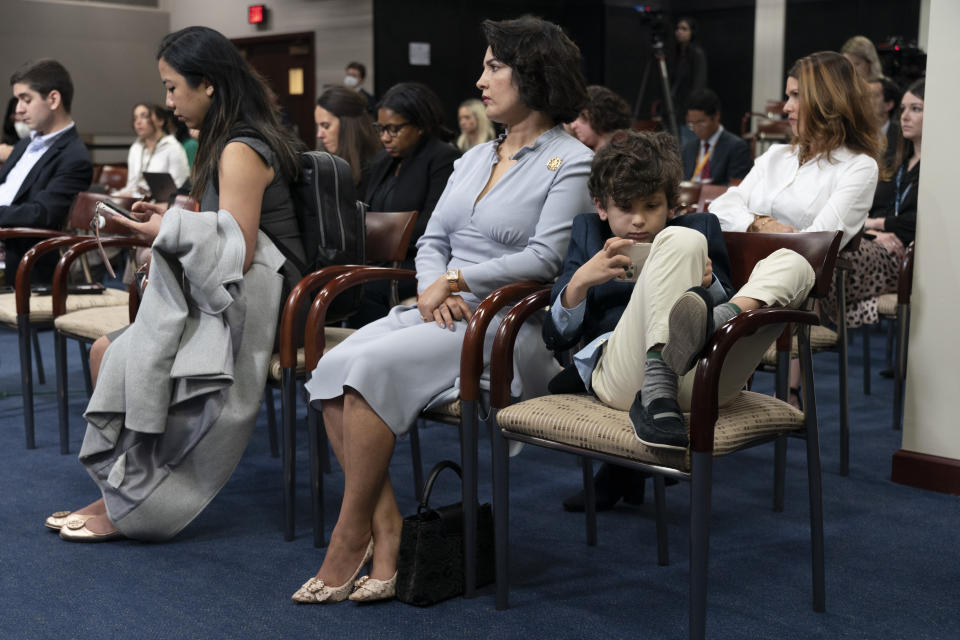 A Congressman's family listens during a news conference with Republicans, mainly veterans and medical professionals, who support Rep. Kevin McCarthy, R-Calif. for Speaker of the House, Wednesday, Jan. 4, 2023, on Capitol Hill in Washington. (AP Photo/Jacquelyn Martin)