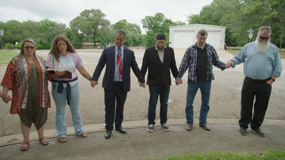 Mark Lee Dickson (center) leads a group of his supporters in prayer outside the location in Athens, Texas where illegal abortions took place in the 1960s.