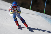 United States' Mikaela Shiffrin speeds down the course of an alpine ski, women's World Cup super-G race in Cortina d'Ampezzo, Italy, Sunday, Jan. 23, 2022. (AP Photo/Gabriele Facciotti)