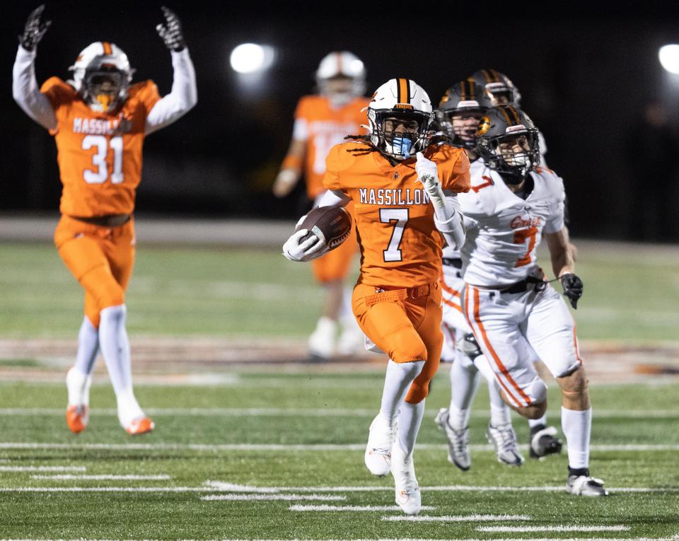 Massillon receiver Jacques Carter runs in for a second half touchdown against Green in the Div. | OHSAA high school football playoffs held at North Canton Hoover High School Friday, Nov. 17, 2023.