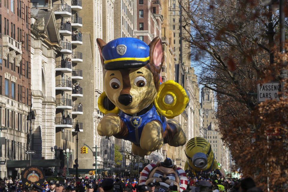 The handlers guide the Paw Patrol balloon along Central Park West during the Macy's Thanksgiving Day parade, Thursday, Nov. 23, 2023, in New York. (AP Photo/Jeenah Moon)