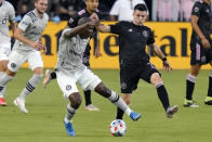 Montreal defender Kamal Miller, left, and Inter Miami midfielder Lewis Morgan go for the ball during the first half of an MLS soccer match Wednesday, May 12, 2021, in Fort Lauderdale, Fla. (AP Photo/Lynne Sladky)