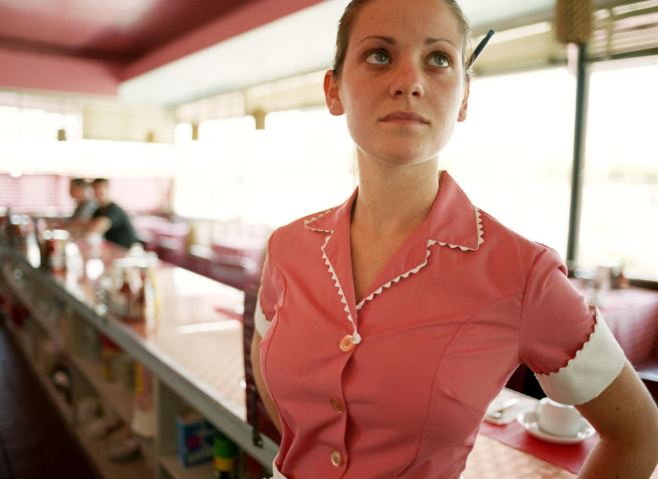 Waitress behind counter in diner