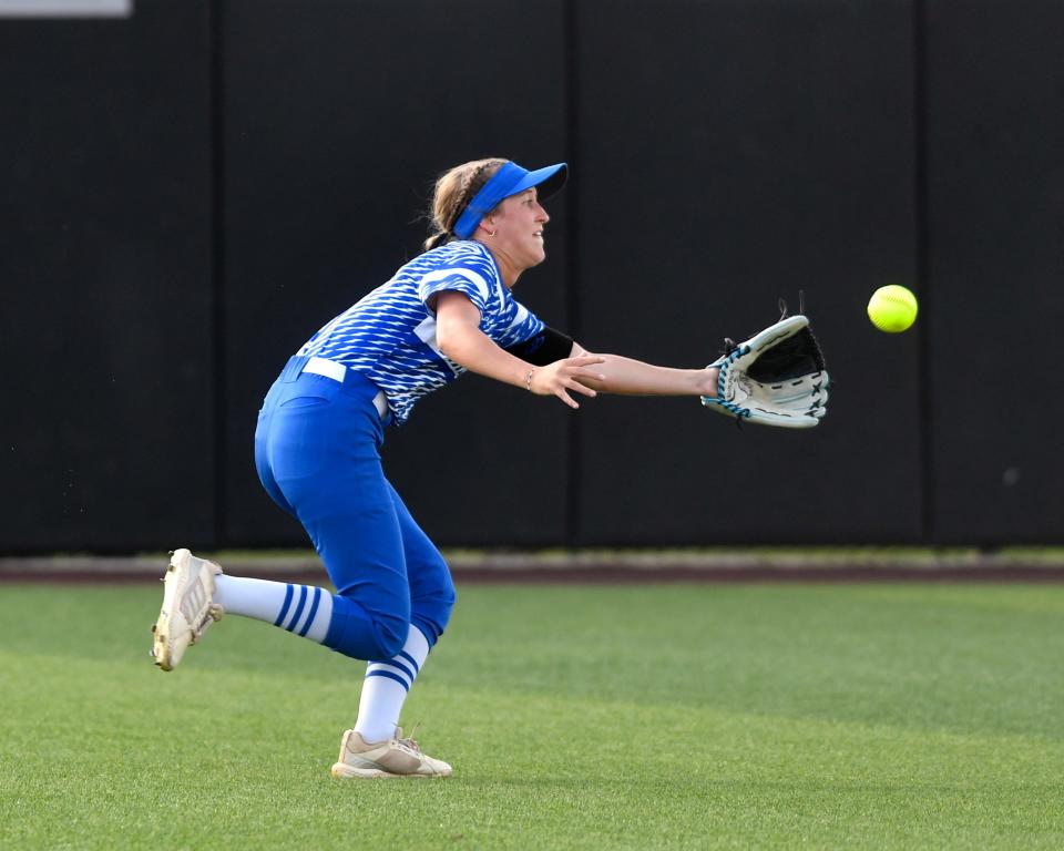 Stamford outfielder Emily Patterson fields a fly ball Thursday.