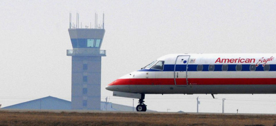 In this March 9, 2010 photo, an American Eagle flight waits for release from the air traffic control tower at Central Illinois Regional Airport in Bloomington, Ill. Under orders to trim hundreds of millions of dollars from its budget, the Federal Aviation Administration released a final list Friday, March 22, 2013, of 149 air traffic control facilities that it will close at small airports around the country starting early next month. The tower at Central Illinois Regional was included on that list. (AP Photo/The Pantagraph, Steve Smedley)