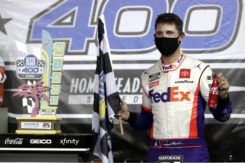 Denny Hamlin celebrates after winning a NASCAR Cup Series auto race Sunday, June 14, 2020, in Homestead, Fla. (AP Photo/Wilfredo Lee)