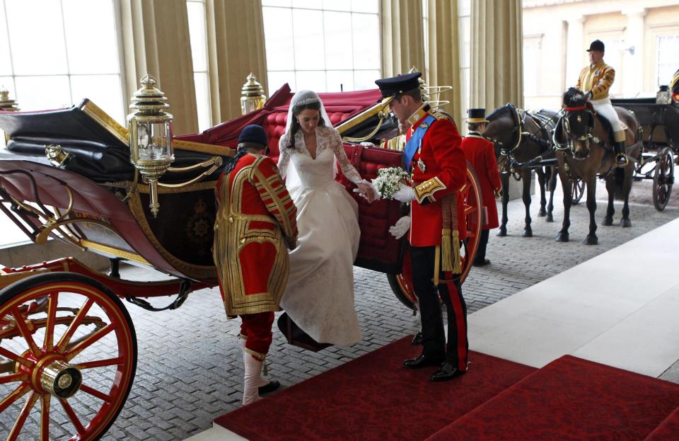 The newlyweds arrive at Buckingham Palace following the wedding ceremony