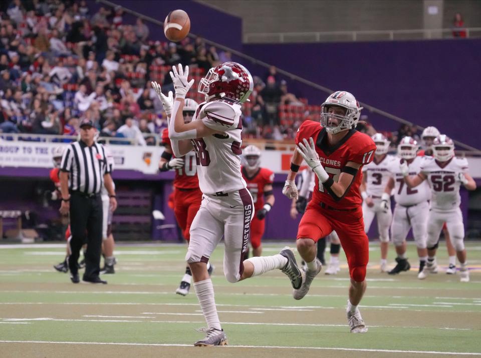 Mount Vernon wide receiver Jensen Meeker completes a pass for a touchdown against Harlan during the Iowa Class 3A state football championship game