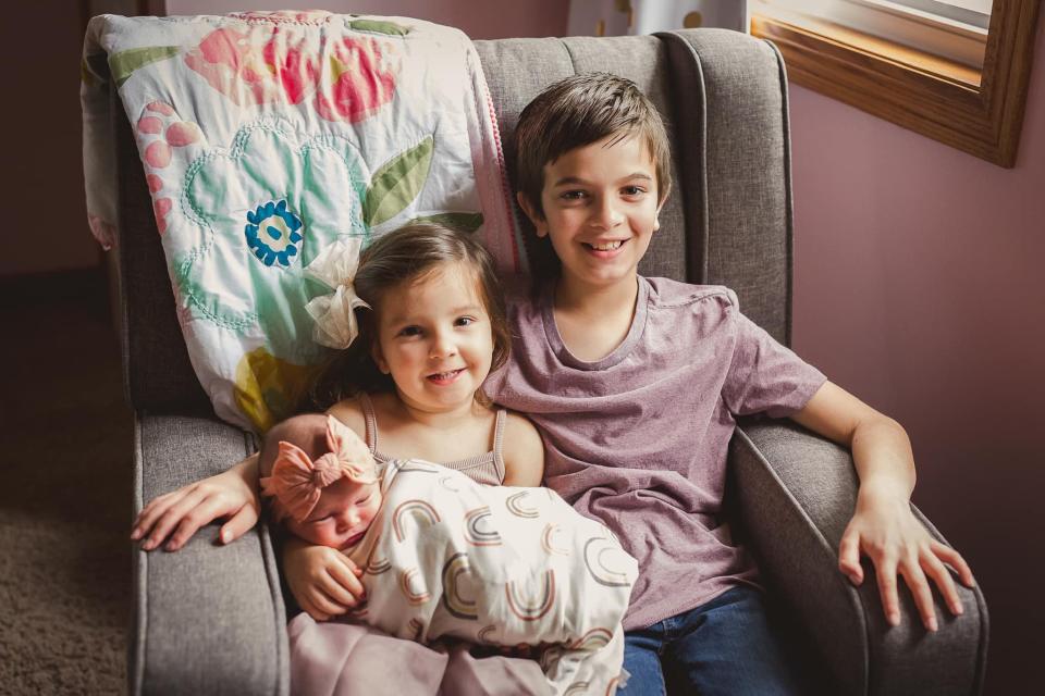 Emryn Bostic is shown with sister Regan, 3, and brother Landon, 11. GLITTER AND GRACE PHOTOGRAPHY