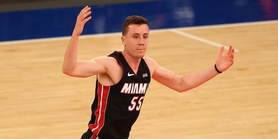 Duncan Robinson holds up his hands.