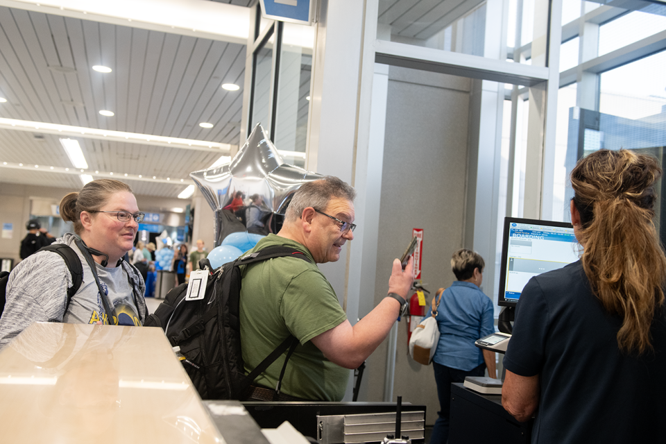 Cerena Cernik, of Portage Lakes, and Blake Sugarberg, of Akron, board the 9:15 Breeze Airways direct flight to Los Angeles from the Akron-Canton Airport in Green on Thursday, May 23.