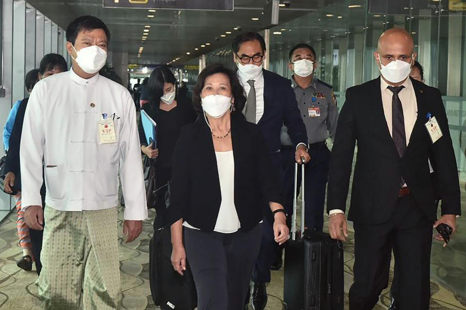 FILE - In this image provided by the Military True News Information Team, United Nations special envoy for Myanmar Noeleen Heyzer, center, arrives at the Yangon International Airport, Tuesday, Aug. 16, 2022, in Yangon, Myanmar. Heyzer warned Tuesday, Oct. 25 that the political, human rights and humanitarian crisis in the military-ruled Southeast Asian nation is deepening and taking “a catastrophic toll on the people.” Heyzer told the U.N. General Assembly’s human rights committee that more than 13.2 million people don’t have enough to eat, 1.3 million are displaced and the military continues operations using disproportionate force. (Myanmar True News information Team via AP, File)