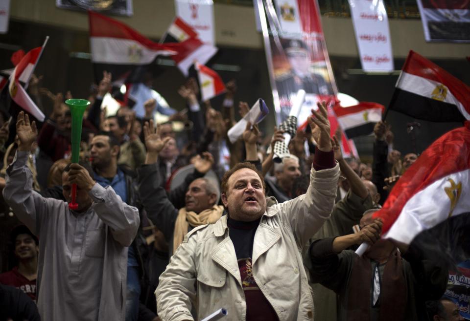 Egyptians chant slogans as they attend a rally in support of Egypt's Defense Minister, Gen. Abdel-Fattah el-Sissi, in Cairo, Egypt, Tuesday, Jan. 21, 2014. Supporters of the powerful army chief and defense minister urged Egyptians on Tuesday to turn the third anniversary to 2011 uprising that toppled longtime autocratic president Hosni Mubarak, to a show of gratitude to the general for ousting Islamist president, calling on him to contest elections. (AP Photo/Khalil Hamra)