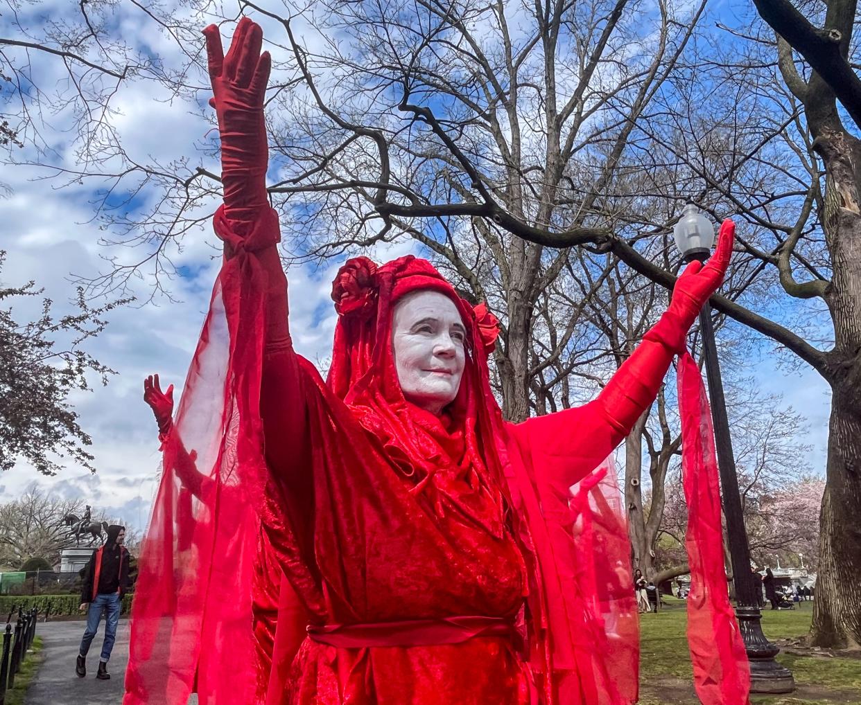 Jenny Allen, 76, of Framingham, joined the "red rebel" protest, which took place on April 21, starting at the Boston Common.
