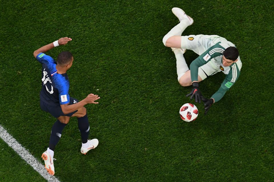 <p>Belgium’s goalkeeper Thibaut Courtois (R) stops the ball after France’s forward Kylian Mbappe (L) shot it during the Russia 2018 World Cup semi-final football match between France and Belgium at the Saint Petersburg Stadium in Saint Petersburg on July 10, 2018. (Photo by Jewel SAMAD / AFP) </p>