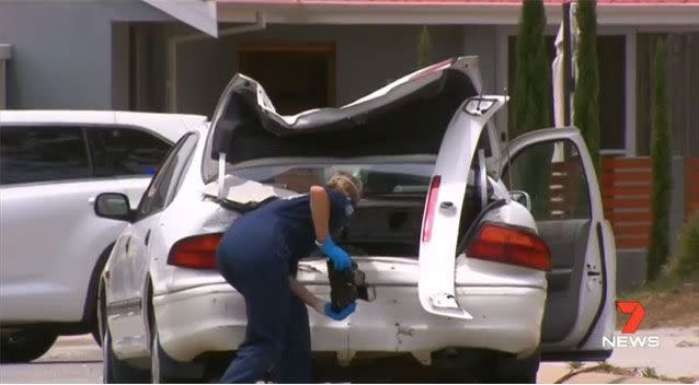 Detectives investigate the car used during the wild rampage. Source: 7 News