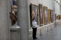 FILE PHOTO: A museum worker wears a protective mask as the Prado museum prepares for reopening on June 6th amid the coronavirus disease (COVID-19) outbreak, in Madrid