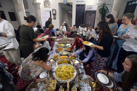 Foreign visitors and residents in the UAE eat an Emirati Iftar meal during the Muslim holy fasting month of Ramadan, at Sheikh Mohammed Centre for Cultural Understanding (SMCCU) in Dubai, UAE May 17, 2019. REUTERS/Satish Kumar