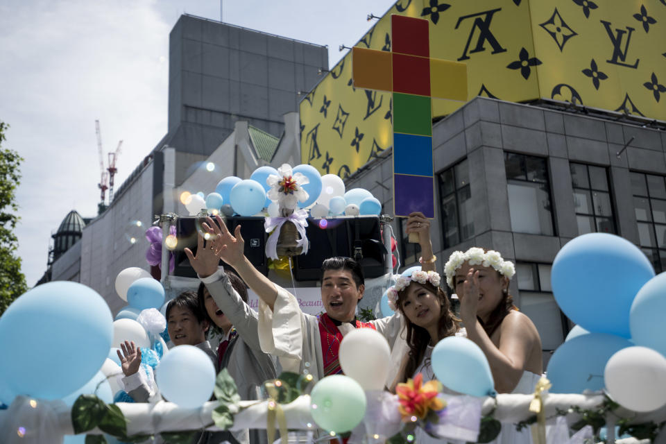 Participants dressed in wedding clothes march in the Tokyo Rainbow Pride Parade.