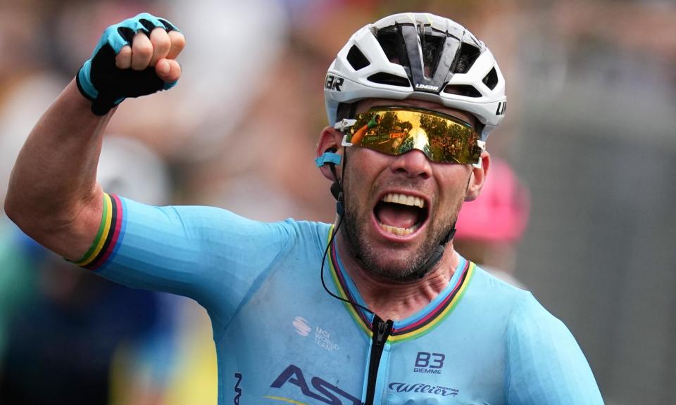 <span>Mark Cavendish punches the air after crossing the finish line.</span><span>Photograph: Daniel Cole/AP</span>