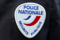 FILE - This March 18, 2015 file photo shows the logo of the French national police during a ceremony in Paris. Thousands of French women have denounced in a new online campaign the shocking response of police officers victim-blaming them or mishandling their complaints as they were reporting sexual abuse. (AP Photo/Remy de la Mauviniere, File)