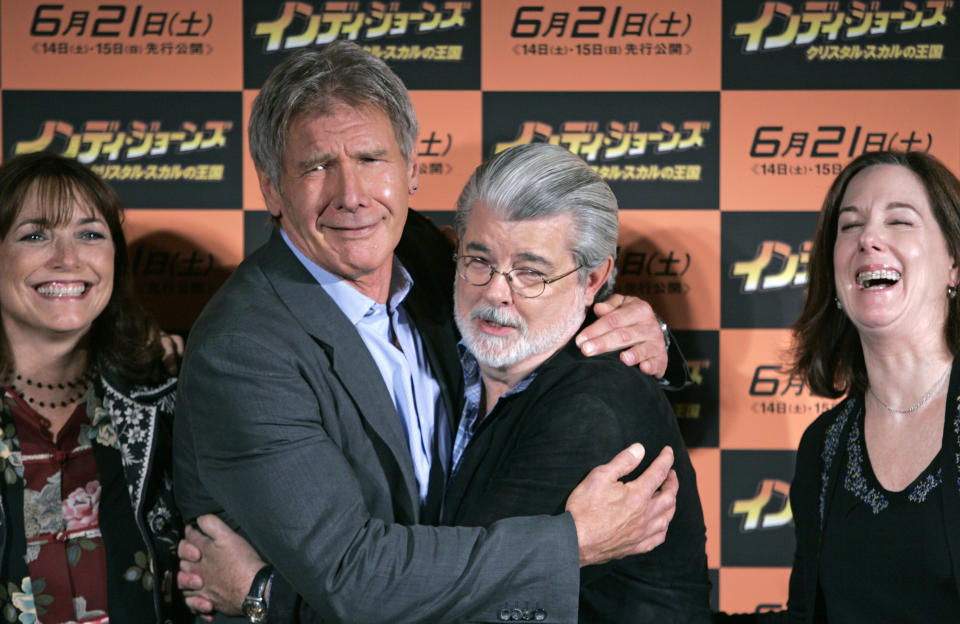 Actor Harrison Ford (2nd L) and executive producer George Lucas (2nd R) pose with actor Karen Allen (L) and producer Kathleen Kennedy (R) during a photocall for "Indiana Jones and the Kingdom of the Crystal Skull" in Tokyo June 4, 2008. REUTERS/Michael Caronna (JAPAN)