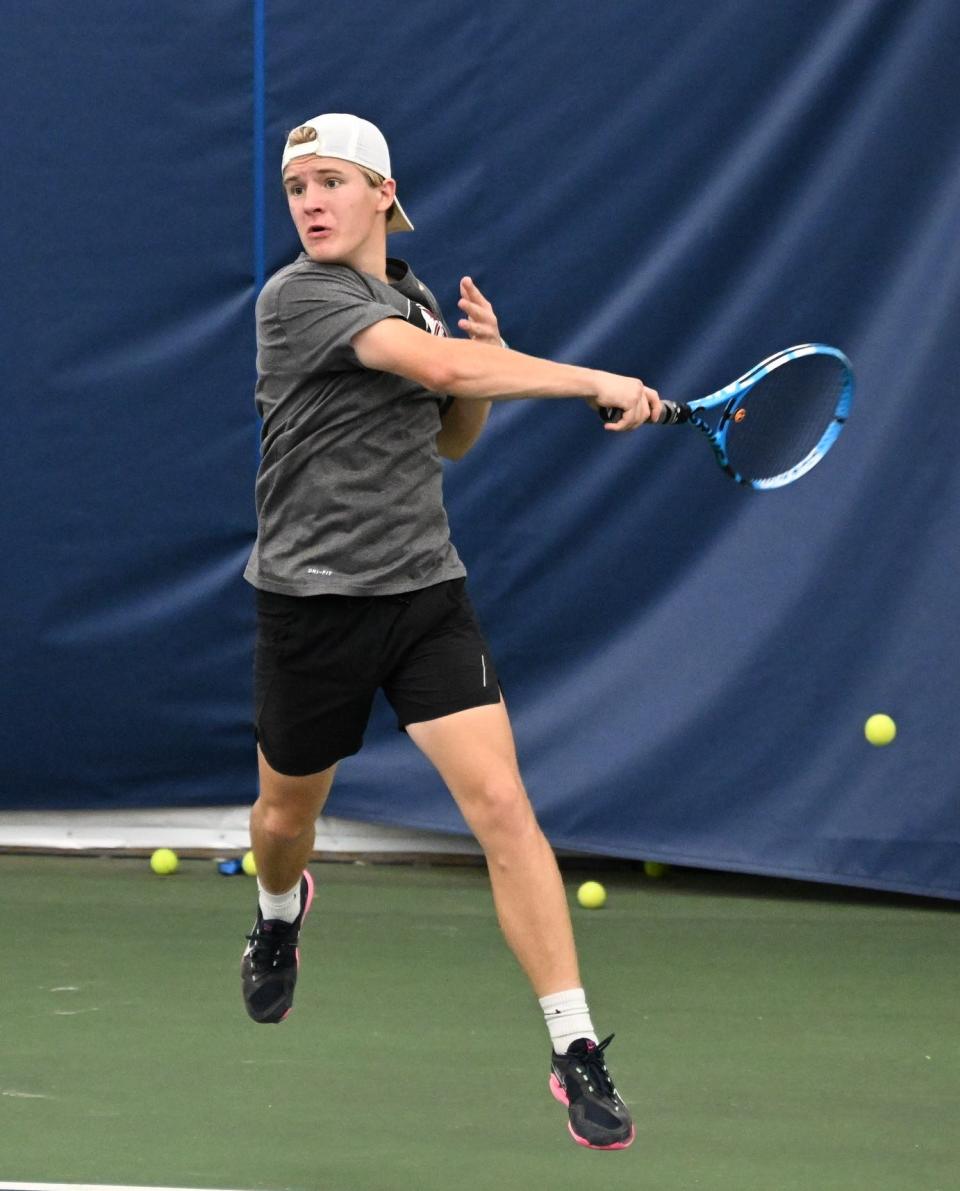 Philip Etzel swats a forehand en route to winning the boys 14-and-under singles title.