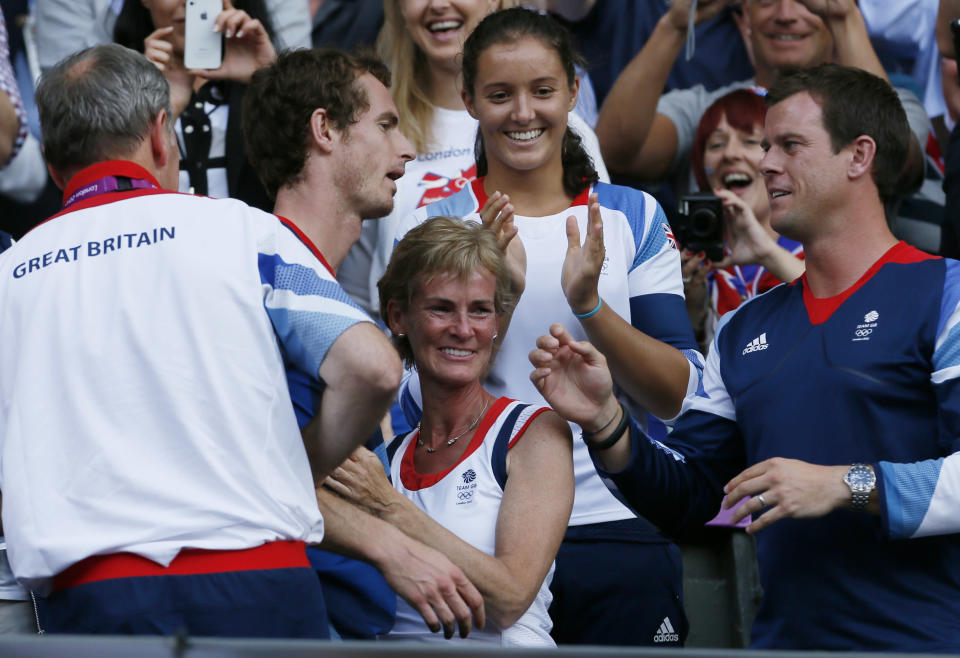 Britain's Andy Murray (2nd from L) greets friends and family, including his mother Judy (C), after defeating Switzerland's Roger Federer in the men's singles tennis gold medal match at the All England Lawn Tennis Club during the London 2012 Olympic Games August 5, 2012. REUTERS/Stefan Wermuth (BRITAIN - Tags: OLYMPICS SPORT TENNIS) 