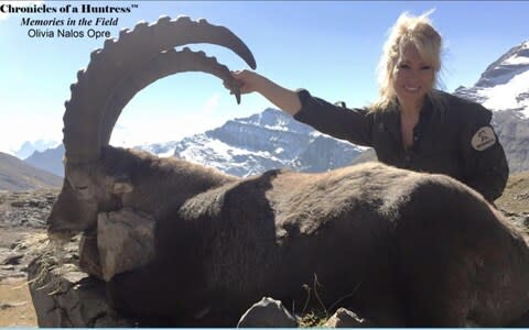 Olive Nalos Opre poses with a hunted Alpine ibex in Switzerland. - Credit: Facebook