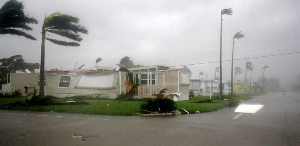 A damaged mobile home stands in the blowing winds and heavy rains of Hurricane Wilma Monday, Oct. 24, 2005 in Davie, Fla.