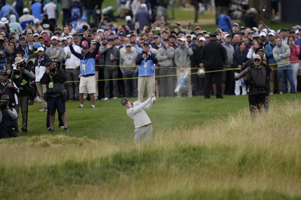 FILE - Matthew Fitzpatrick, of England, hits on the 18th hole during the final round of the U.S. Open golf tournament at The Country Club, Sunday, June 19, 2022, in Brookline, Mass. His 9-iron from the bunker on this hole set up the par he needed for a one-shot victory. (AP Photo/Robert F. Bukaty, File)