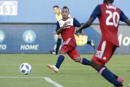 Aug 4, 2018; Frisco, TX, USA; FC Dallas forward Michael Barrios (21) passes to midfielder Roland Lamah (20) who scores a goa in the first half against the San Jose Earthquakes at Toyota Stadium. Mandatory Credit: Tim Heitman-USA TODAY Sports