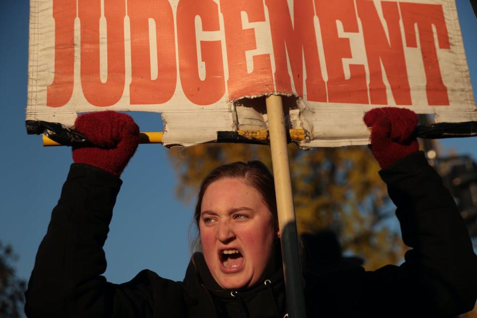 <span class="caption">An anti-abortion demonstrator hurls insults at abortion rights activists in front of the U.S. Supreme Court on Dec. 1, 2021.</span> <span class="attribution"><a class="link " href="https://www.gettyimages.com/detail/news-photo/an-anti-abortion-demonstrator-hurls-insults-at-pro-choice-news-photo/1356625984?adppopup=true" rel="nofollow noopener" target="_blank" data-ylk="slk:Chip Somodevilla/Getty Images;elm:context_link;itc:0;sec:content-canvas">Chip Somodevilla/Getty Images</a></span>