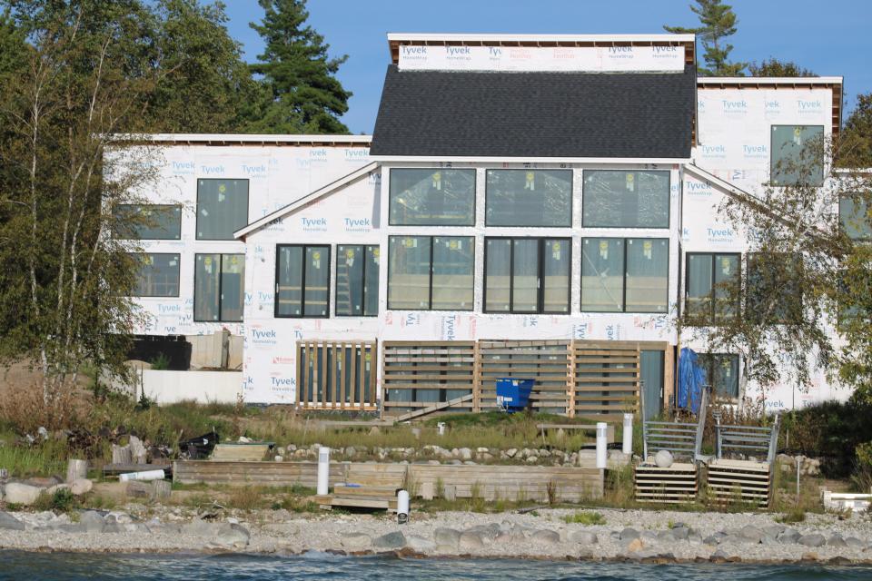 A waterfront home under construction on Lake Charlevoix.