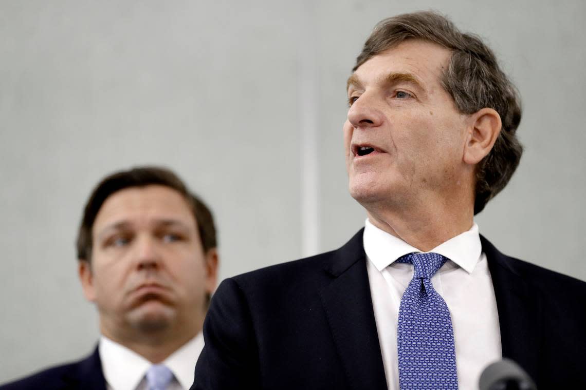 Former Florida Surgeon General Dr. Scott Rivkees, right, speaks to the media as Florida Gov. Ron DeSantis looks on during a news conference Monday, March 2, 2020, in Tampa. Rivkees accepted a job at Brown University, Monday, Nov. 22, 2021, to work on the school’s pandemic preparedness.