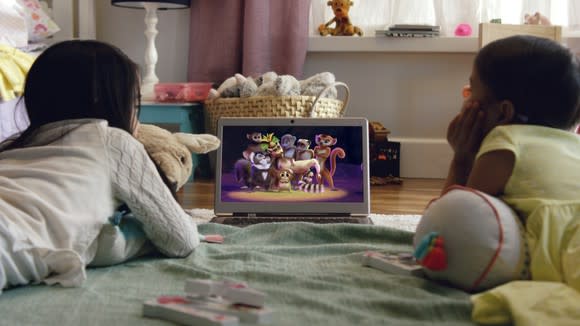 Two kids watching Netflix on a laptop.