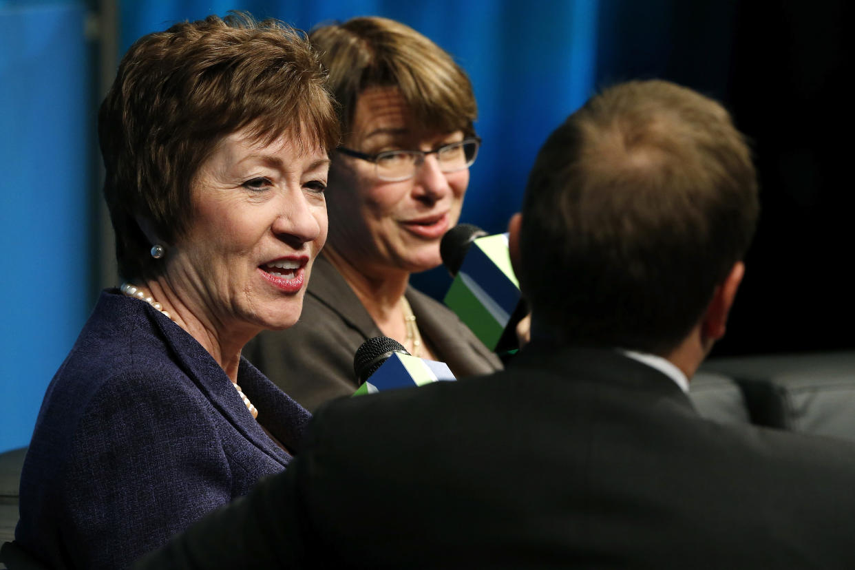 U.S. Senator Susan Collins (R-ME) (L) and Senator Amy Klobuchar (D-MN) (2nd L) participate in the Washington Ideas Forum at the Newseum in Washington November 13, 2013.  REUTERS/Jonathan Ernst    (UNITED STATES - Tags: POLITICS)