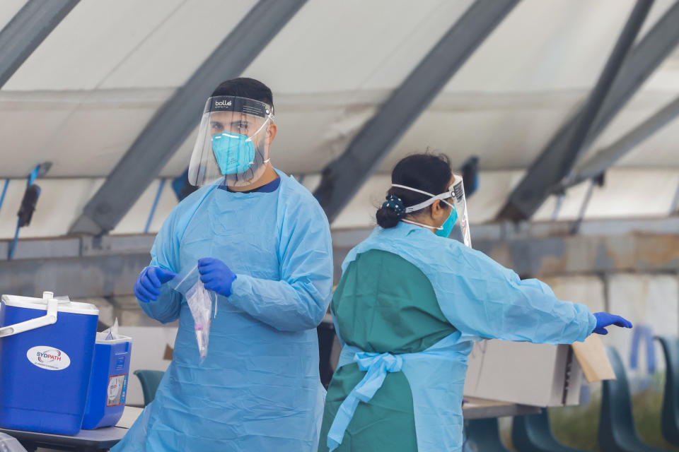 Two health workers at a Covid testing centre in NSW.