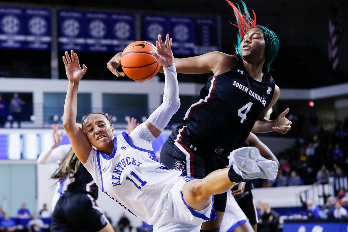 Kentucky’s Jada Walker (11) falls after her shot is blocked by South Carolina’s Aliyah Boston (4) during Thursday’s game at Memorial Coliseum.