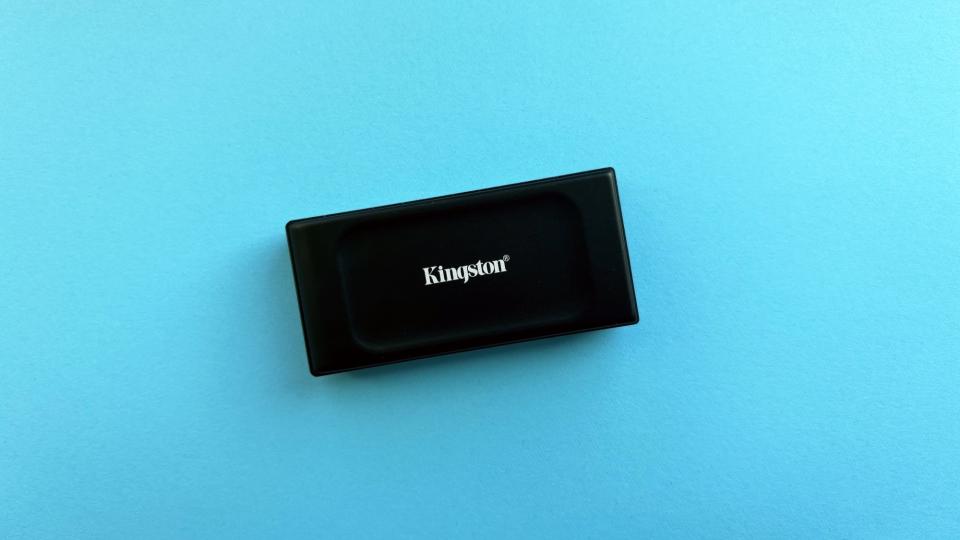 The Kingston XS1000 against a light blue background.