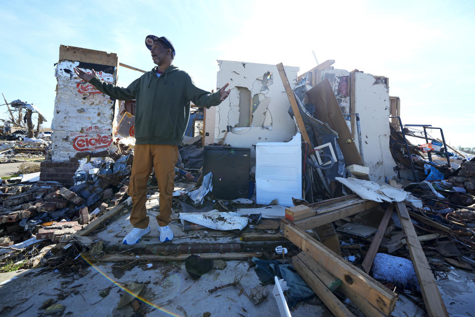 Jermaine Wells, neighbor of Lonnie and Melissa Pierce, who were killed when the truck landed on their house during a tornado that hit three days earlier, talks about the destruction to his home, Monday, March 27, 2023, in Rolling Fork, Miss. (AP Photo/Julio Cortez)