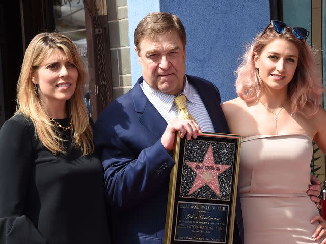<p>Jim Smeal/Shutterstock </p> John Goodman with his wife Anna Beth Goodman and their daughter Molly on The Hollywood Walk of Fame on March 10, 2017.